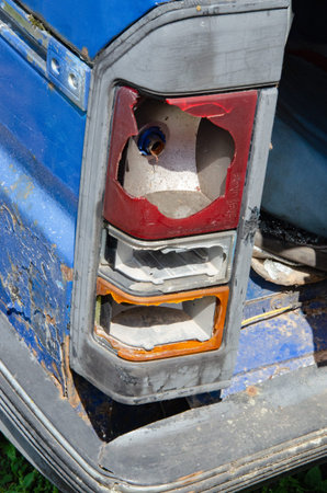 Old vintage wrecked car. Burnt out car after an explosion or fire. Burnt car interior with ash,...