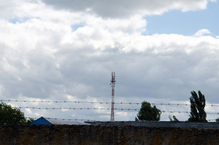 Telecommunications tower with 4G, 5G transmitters. cellular base station with transmitting antennas...