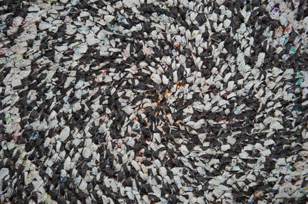 Bright gray background with red spangles. High resolution photo.の写真素材