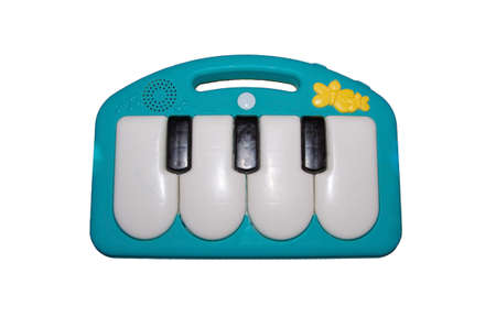 Electric piano keyboard for small kids isolated on the white background. With clipping path. Children plastic toy in the shape of musical instrument with colorful buttons.の写真素材
