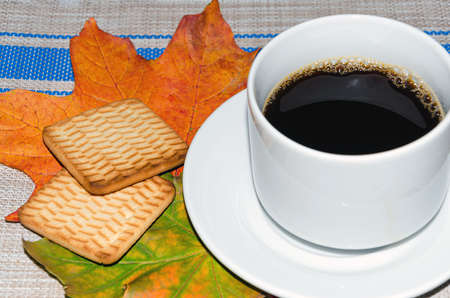 side view of a cup of coffee and cookiesの写真素材