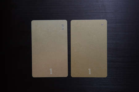 Business Card MockUp US Standard 3.5 x 2 inches . Empty Golden Rough Paper Cards Isolated on a Black Background.の写真素材