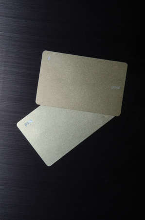 Business Card MockUp US Standard 3.5 x 2 inches . Empty Golden Rough Paper Cards Isolated on a Black Background.の写真素材