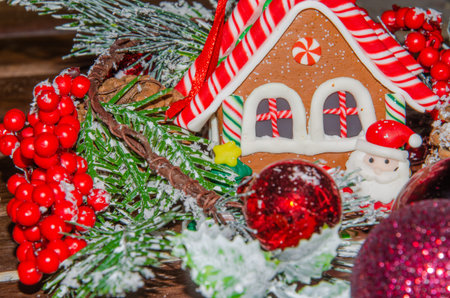 Christmas decorative, homemade toys - Santa Claus, snow-covered wooden background,