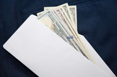 One hundred dollar banknote money in pocket jeans pants background texture. 100, 50 dollar bill close up. Corruption.の写真素材