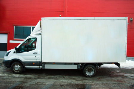 Several cars vans trucks parked in parking lot for rent