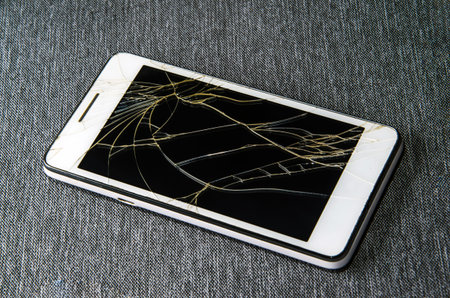 Crack on the glass. Broken screen. Broken phone. Cracked glass background.の写真素材