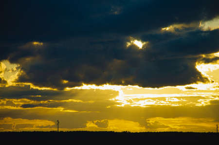 Gorgeous panorama scenic of the strong sunrise with silver lining and cloud on the orange skyの写真素材
