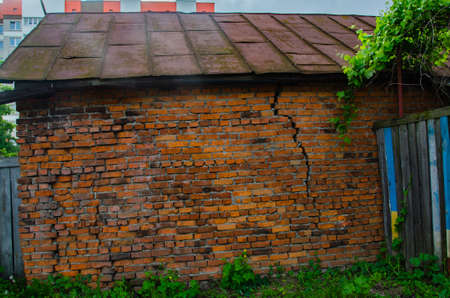 red brick wall texture grunge background with vignetted corners, may use to interior designの写真素材
