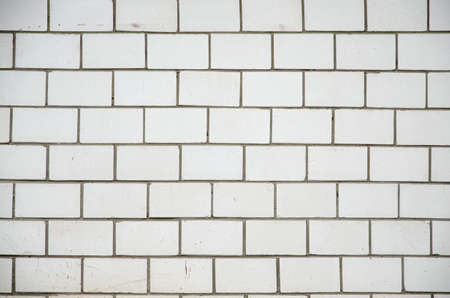 White brick wall, perfect as a background, square photographの写真素材