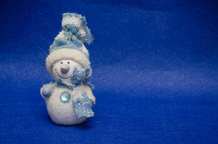 Christmas card. toy snowman on Christmas background.の写真素材