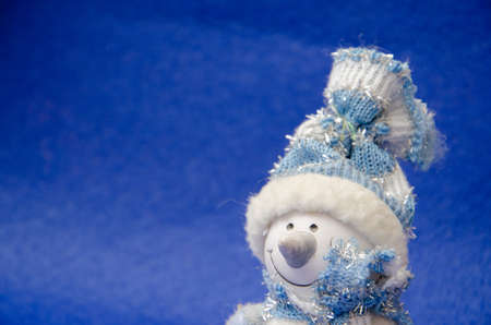 Christmas blue background with stars and snowflakes snowmanの写真素材