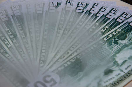 A group of dollar bills lie together. Hundred dollar bills close-up. finance.の写真素材