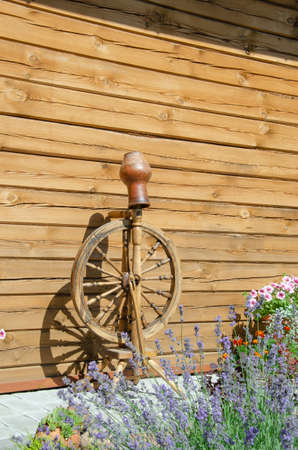 old fashioned wooden spinning wheels, spindle, spinning wheel, vintage yarn making equipmentの写真素材