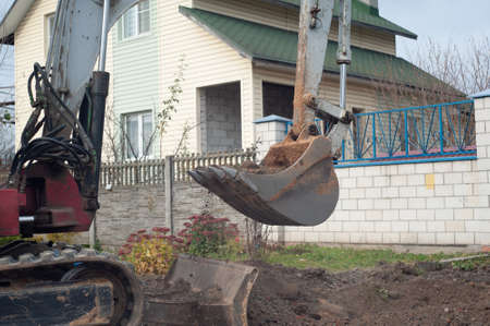 Crawler excavator digging on demolition site. Excavating machine. Earth moving equipment. Excavation vehicle. Construction business.の写真素材