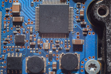 Close-up Macro Shot of Electronic Factory Machine at Work: Printed Circuit Board Being Assembled...