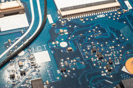 Close-up Macro Shot of Electronic Factory Machine at Work: Printed Circuit Board Being Assembled...