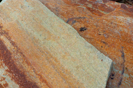 A mountain of gold, red stones from shale rocksの写真素材