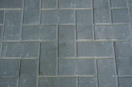 Sidewalk textured background. Detail of a pavement street stoneの写真素材