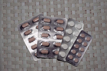A variety of pills in blisters on a gray dirty background copy space. Medicinesの写真素材