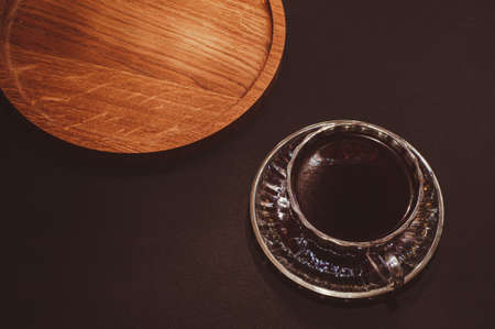 Top view of a cup of coffee, isolate on black backgroundの写真素材