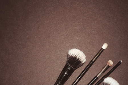 Makeup brushes on a black background, with a place to insert text, beautyの写真素材