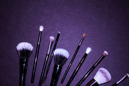 Makeup brushes on a black background, with a place to insert text, beautyの写真素材