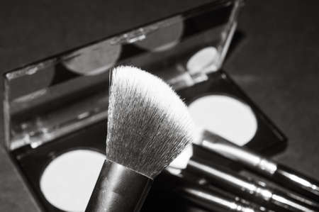 Makeup brushes on a black background, with a place to insert text, beautyの写真素材