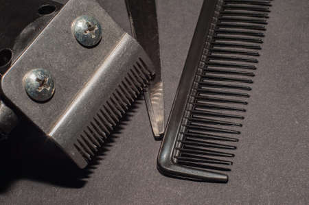 hairdresser electric machine. Shaving machine for barber on gray background. hair trimmer. Home or hairdressing salon hair cut toolsの写真素材