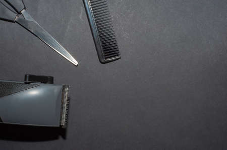 hairdresser electric machine. Shaving machine for barber on gray background. hair trimmer. Home or hairdressing salon hair cut toolsの写真素材