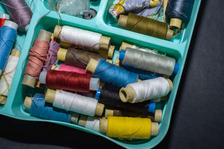 multicolored bobbin thread. Polypropylene multifilament yarns. Set of sewing thread coilsの写真素材