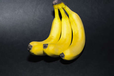 Bunch of banana isolated on black background.の写真素材