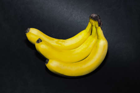 Bunch of banana isolated on black background.の写真素材