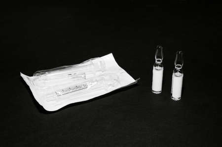 Medical disposable syringes with needles in the package.の写真素材