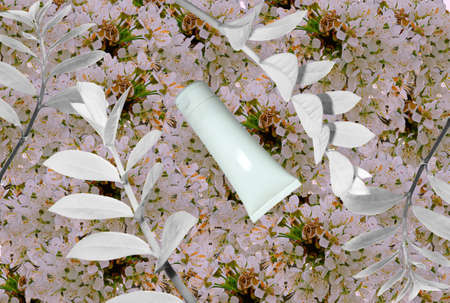 Top view of mockup of white squeeze bottle plastic tube for branding of medicine or cosmetics - cream, gel, skin care, toothpaste. Cosmetic bottle container on a pastel blue background. minimalismの写真素材