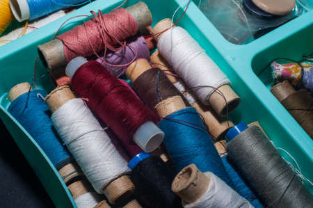 multicolored bobbin thread. Polypropylene multifilament yarns. Set of sewing thread coilsの写真素材