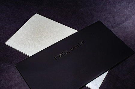 Black envelope on a black flat background, luxury corporate identity and corporate identity design...