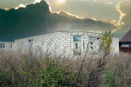 Building site of a house under construction made from white foam blocks. Building new frame of home.の写真素材