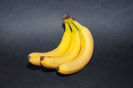 Bunch of banana isolated on black background.の写真素材
