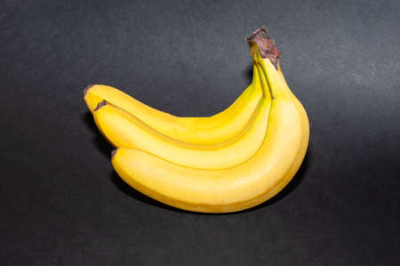 Bunch of banana isolated on black background.の写真素材