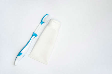 Purple bamboo tooth brush and paste on white background.の写真素材
