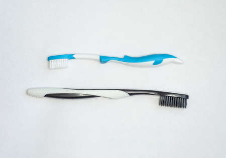 two toothbrushes for adults and children isolated on white backgroundの写真素材