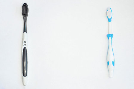 two toothbrushes for adults and children isolated on white background