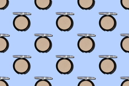 Seamless pattern of face cream shaped packaging with open lid isolated on a blue background. Tomato skin care series. flat lay.の写真素材