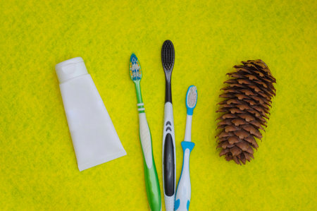 Toothbrushes on a yellow background. Health care, dental hygiene. Space for text. top view.の写真素材