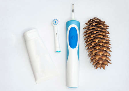 toothbrushes for adults and children and a tube of paste on an isolated white background. with a place to insert textの写真素材