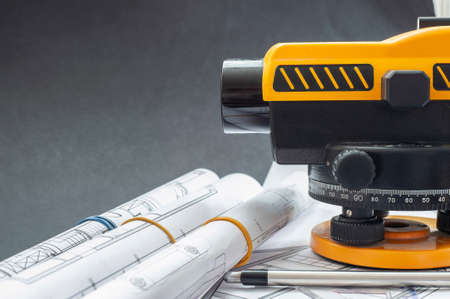 Photographer of a level at a construction site. construction in the background.の写真素材