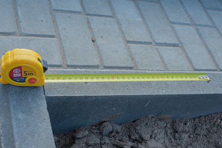 Measuring tape scale yellow roll construction tool inch centimeters size, meter equipament work precise.の写真素材
