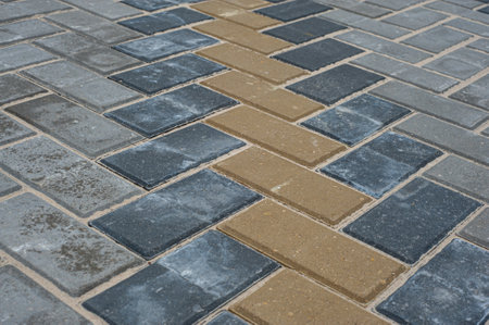Paving slabs of different colors and shapes.Texture of different colored patterned paving slabs .の写真素材