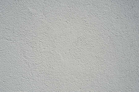 White stucco wall background. White painted cement wall texture stoneの写真素材